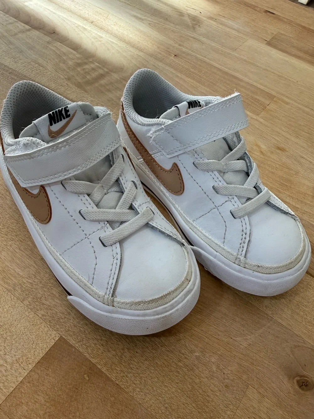 Nike Kids White Sneakers with Metallic Gold Swoosh